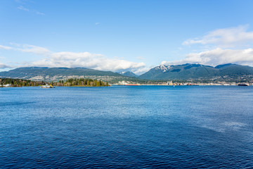 Vancouver, British Columbia, Canada - December, 2019 - Mountain View with clouds in a Beautiful blue sky day.