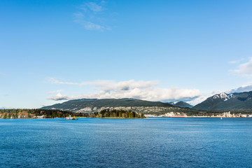 Vancouver, British Columbia, Canada - December, 2019 - Mountain View with clouds in a Beautiful blue sky day.