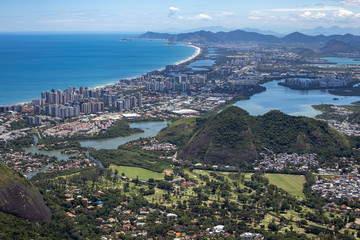 Barra da Tijuca neighbourhood in Rio de Janeiro with city lake and high rise buildings and golf club course in the foreground seen from the Pedra Bonita rock in the Tijuca forest