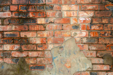 Old brickwork with leftover cement red brick.