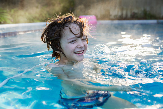 A six year old boy swimming in a warm pool. ,St Simon's Island