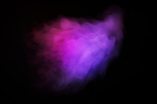 Abstract neon light smoke effect on black background. Smoke cloud explosion.