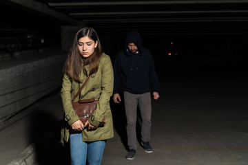 Thief Sneaking On Female Victim In Dark Alley
