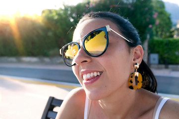 smiling girl with dental diamond piercing