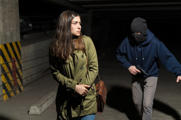 Criminal Walking Behind Female Victim In Alley