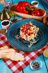 salad with shrimp and quail eggs and red caviar