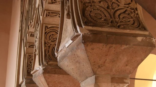 Ornaments in ancient arches in Muslim Nasrid palace, Alcazaba, Malaga. Tilt