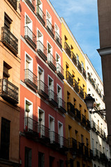 Yellow and orange houses with balconies, La Latina, Madrid, Spain