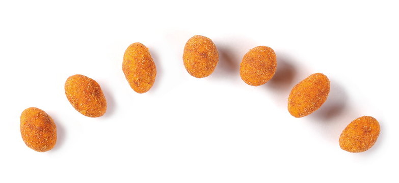 Spicy peanuts pile isolated on white background, top view