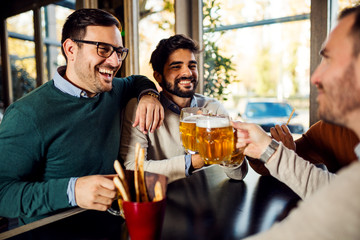 Friends enjoying a beer at pub