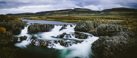 Naklejka na ściany i meble Dark and calm long exposure of glannifoss in Iceland