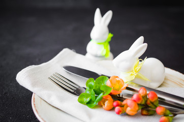 Easter table setting with spring flowering branches. Spring background for menu.