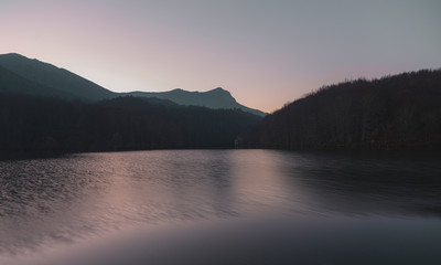 Montseny Mountain reflected in Santa Fe Lake at sunset larga exposicion