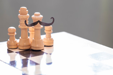 Chess pieces on the board, white and black. Game and life.