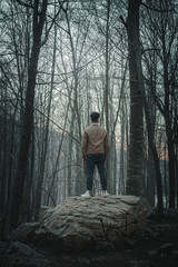 Traveler in the middle of the mountain forest of Montseny in front of the Santa Fe swamp