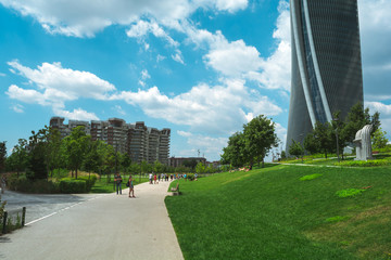 Milan, Italy - June 23 2018: A walk in City Life Shopping District in Milan on a sunny day.