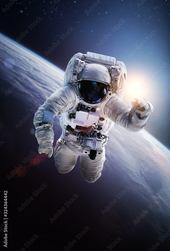 Poster astronaut in the outer space on orbit of the planet earth. abstract wallpaper. spaceman. elements of