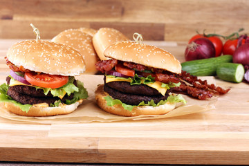 Tasty fresh meat burgers with salad and cheese. Homemade angus burger.