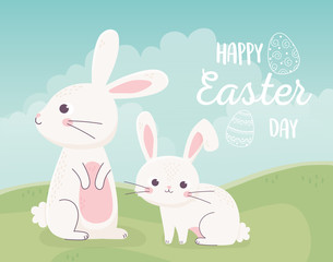 happy easter cute little rabbits in the field nature card