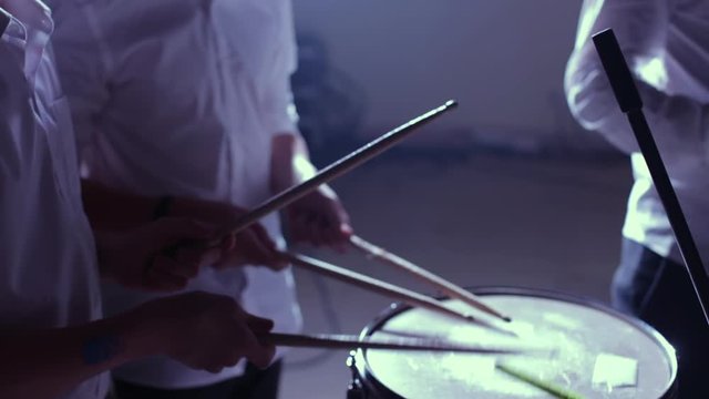 drummer, jazz lesson , percussion drumsticks , drumroll on a snare a rehearsal studio on a drums , low key, close-up