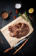 Grilled beef with spices, salt and rosemary