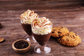 hot chocolate with cocoa and chocolate chip cookies and whipped cream