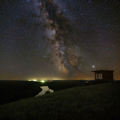 View of the Milky Way over the river. Bright stars of the night sky. Astrophotography with a long exposure.
