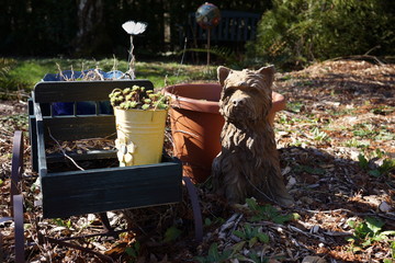 Terrier dog sculpture in winter garden