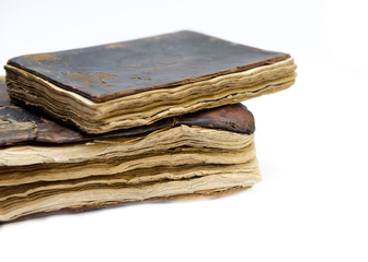 The old, worn and patched Qur'anic religious book.
