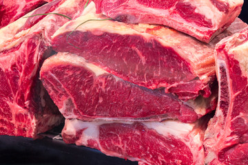 Showcase with raw meat in butcher shop. Fresh meat in supermarket