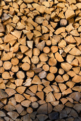 Log firewood stacked on top of each other.
