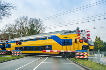 Fototapeta na wymiar Zeist, Netherlands - January 04, 2020. Railroad crossing with red lights