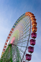 Big color ferris wheel with blue sky background