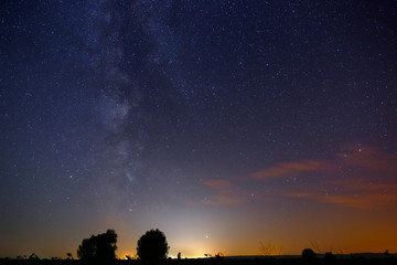 Stars of the Milky Way in the night sky. Landscape photographed with a long exposure.