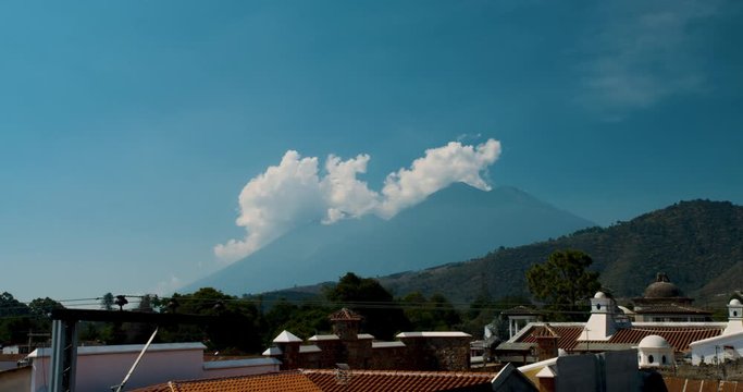 Fuego Volcano City Timelapse with Clouds Behind Landmark in Antigua Guatemala