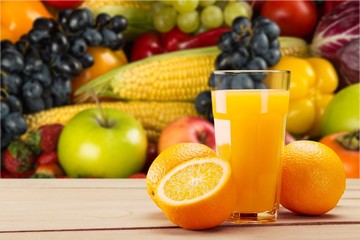 Orange juice in glass and slices of orange fruit