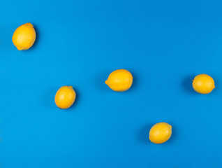 Pop art style, Cassiopeia constellation of ripe yellow lemons on bright blue background 