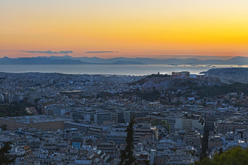 Acropolis in Greece and the city at sunset