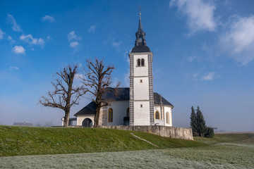 Suha church in Skofja loka in morning mist
