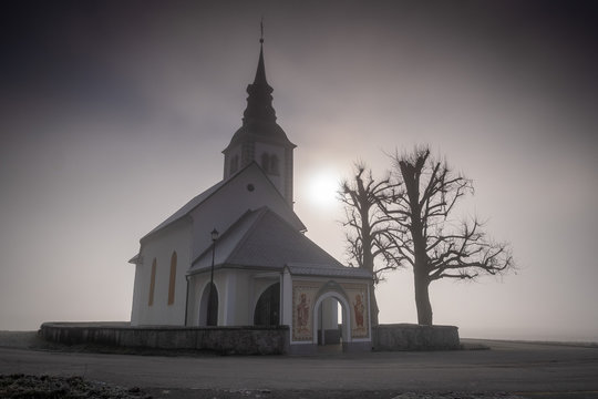 Suha church in Skofja loka in morning mist