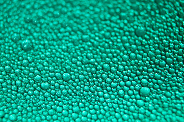 Water drop texture on turquoise background