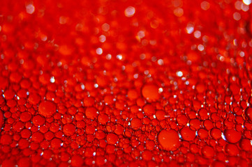 Water drops texture on red background