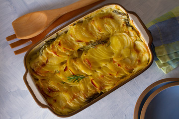 Potato gratin, side dish. Scalloped potatoes or potato bake. Healthy vegetarian dish. Flat lay image
