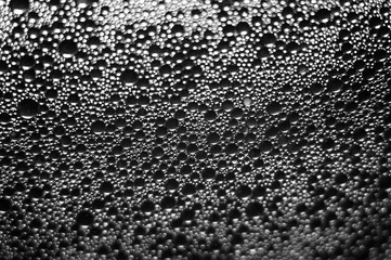 Water drops texture on black background