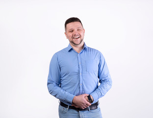 Close up portrait of smiling handsome man in blue shirt looking at camera, isolated on white background