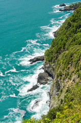 Fototapeta na wymiar Majestic rocky and ocean view from famous trail between Monterosso and Vernazza, Italy.