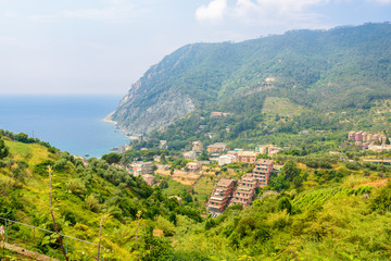 Fototapeta premium Monterosso in Cinque Terre, Italy, view at the town from mountain trail