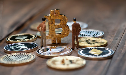 Digital coins with figurines, an interpretation of investors