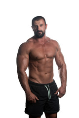 Fototapeta na wymiar Muscular Bodybuilder Guy Posing Over White Background
