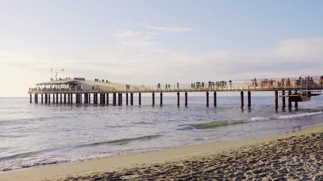Versilia, Italy, Lido di Camaiore modern pier at sunset. Known for fashionable Riviera resorts, it consists of numerous clubs that are frequented by local celebrities. Gimbal